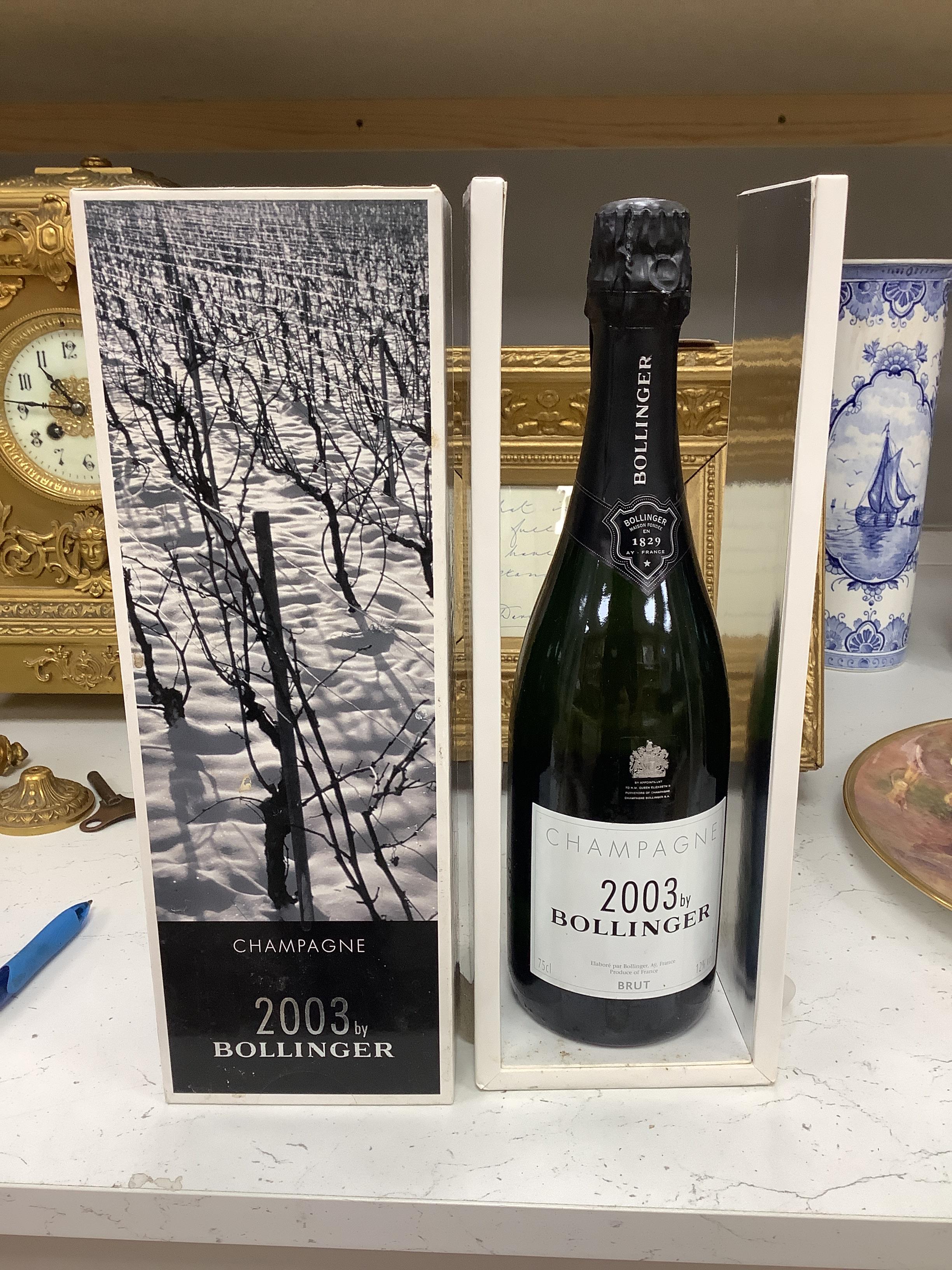 Three bottles of champagne including 2003 Bollinger, boxed